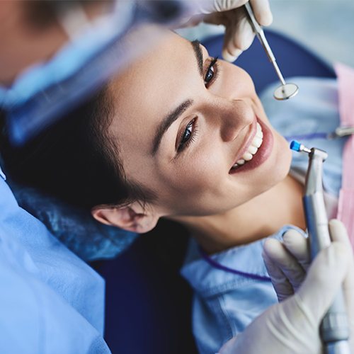 woman getting dental cleaning