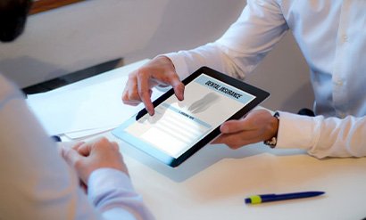 a person holding a tablet with a dental insurance form
