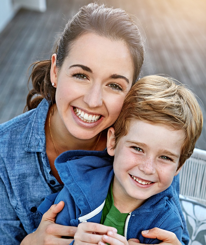 mother with son smiling 