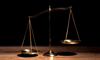 Balance scale on wooden table