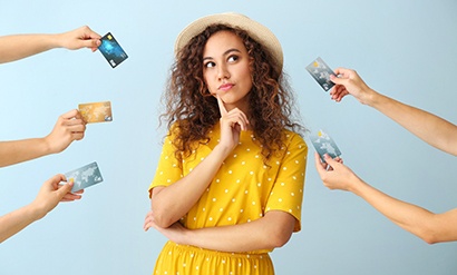 Woman surrounded by credit cards