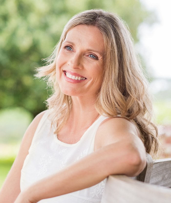 blonde woman smiling outside