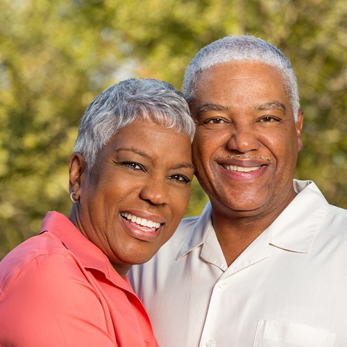 husband and wife smiling together