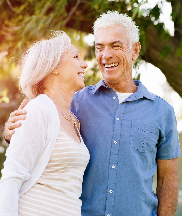 man and woman smiling at each other