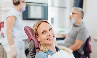 Woman smiling in the dental chair