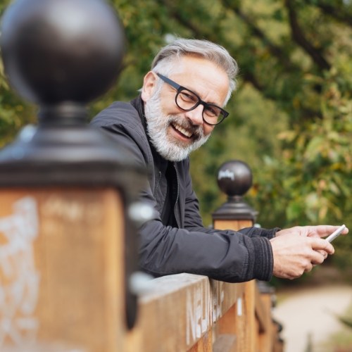 a dentist holding an imaginary dental implant