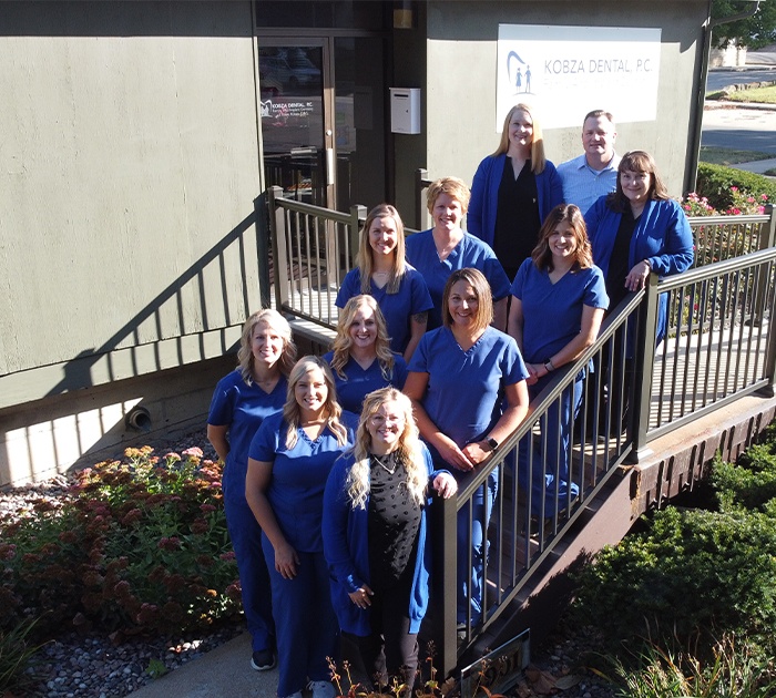 Falls City team in front of dental practice