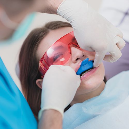 girl getting fluoride treatment