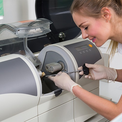 woman working with cerec machine