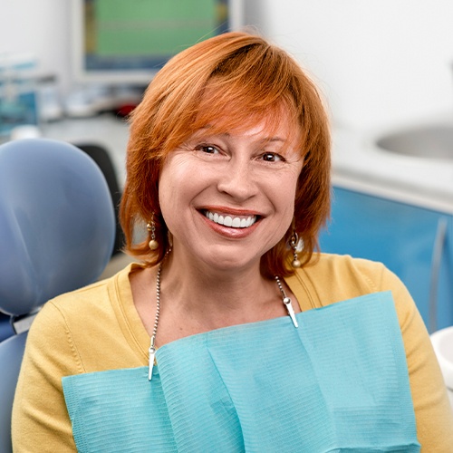 woman in yellow shirt smiling