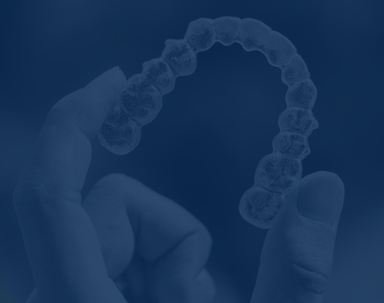 hand holding invisalign