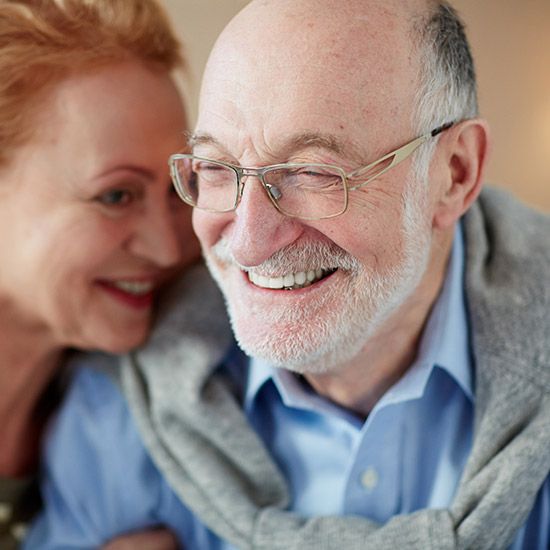 Senior man and woman smiling together