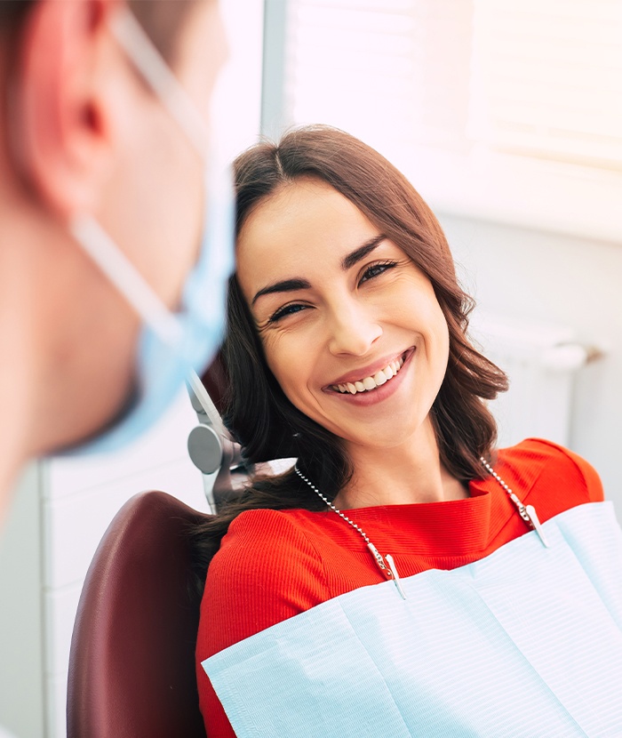 woman laying back in exam chair