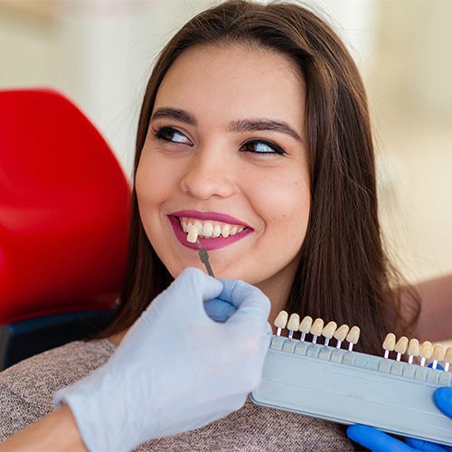 girl holding veneer chart