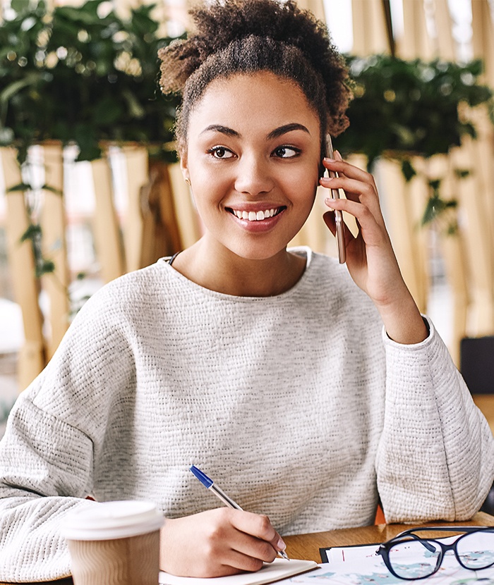 girl smiling talking on phone